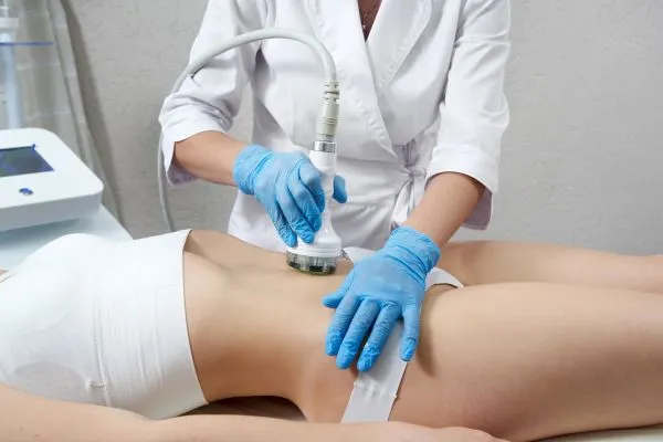 Lost the Weight but Not the Loose Skin? 2 woman having HIFU treatment on her stomach to combat loose skin Brent following weight loss
